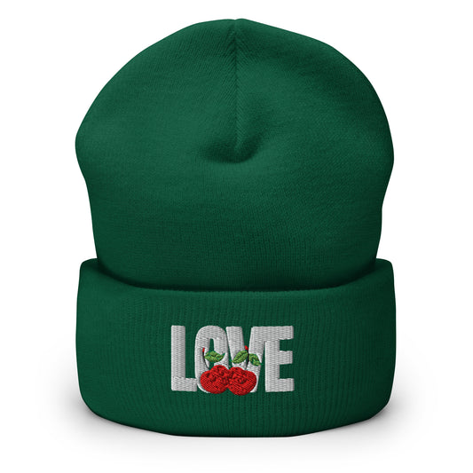 Green beanie with 'LOVE' and rose embroidery on a white background