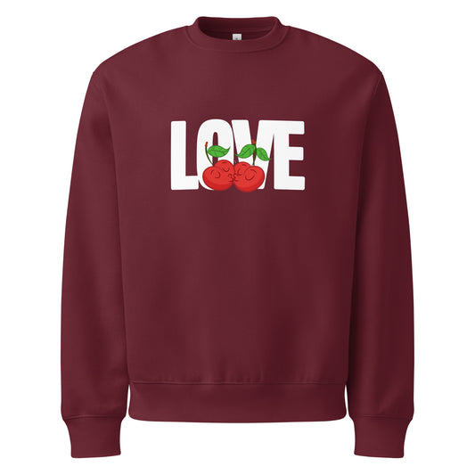 Maroon sweatshirt with 'LOVE' and apple graphics on a white background